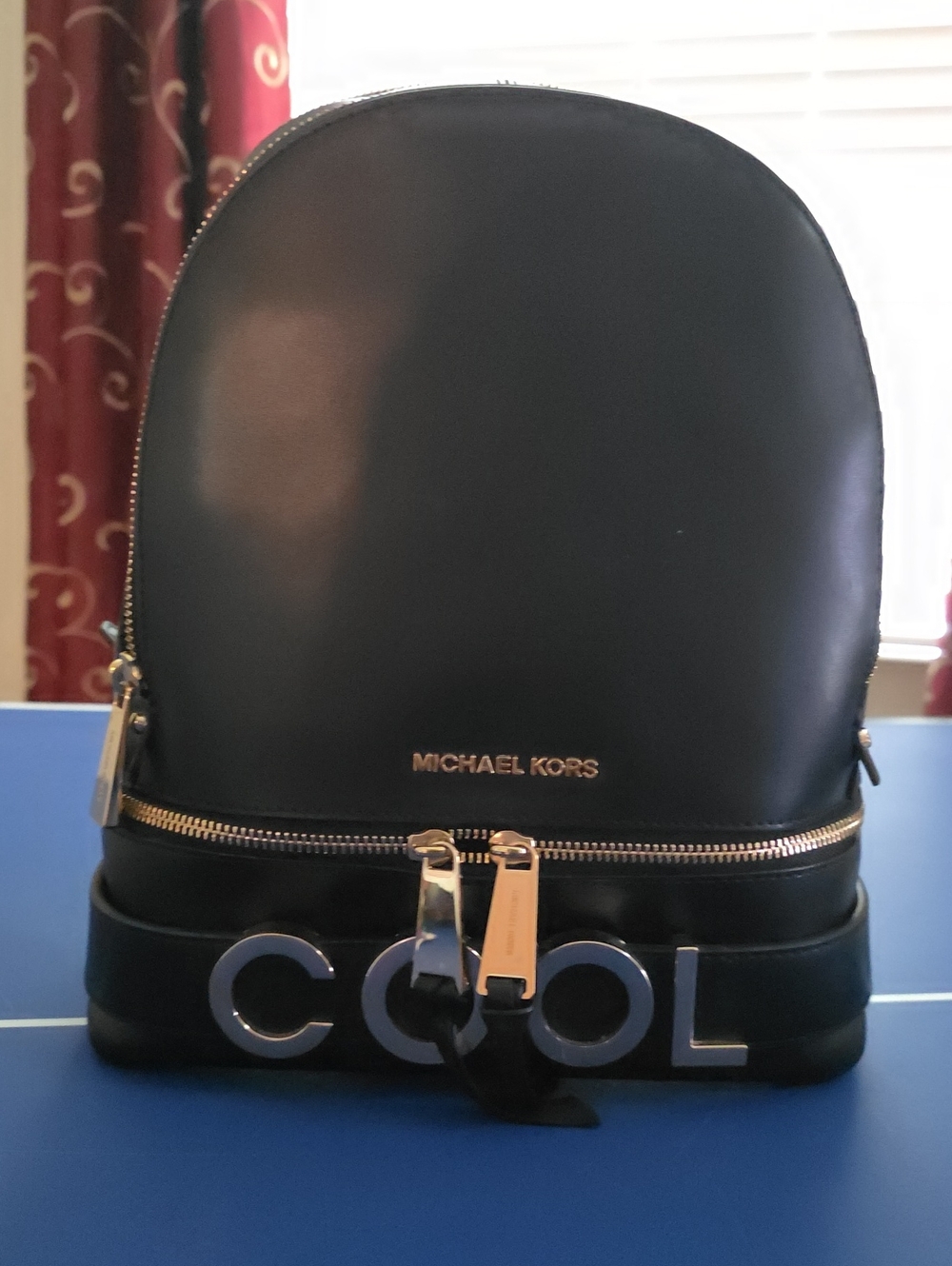Michael Kors Black Leather Backpack with 'COOL' Detail and Gold Hardware